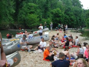 Families take a lunch break on a bend in the river.