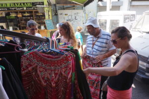 Emma and Hannah help our guide Moshe pick up a pair of lounge pants for his daughter.