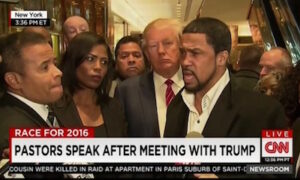 Donald Trump (middle) meets the press with prominent black pastors after a meeting in New York.